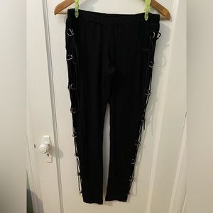 Bat Attack black leggings with metal loops and corset like strings on the sides.